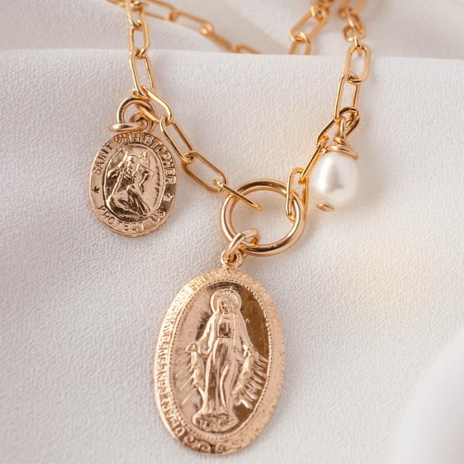 Zoya Mary Saint Christopher 14k gold filled paperclip charm necklace displayed on light cream background