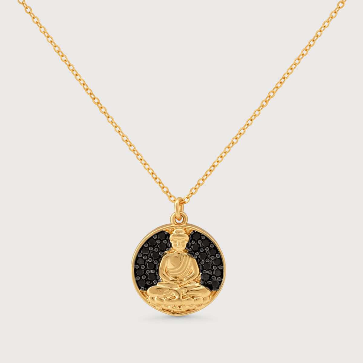 14k gold filled Buddha medallion necklace with black crystal details displayed flat on light gray background