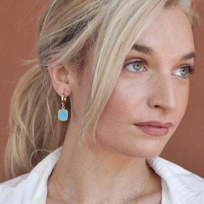 Blonde woman wearing Gemma Turquoise 14k gold plated hoop earrings