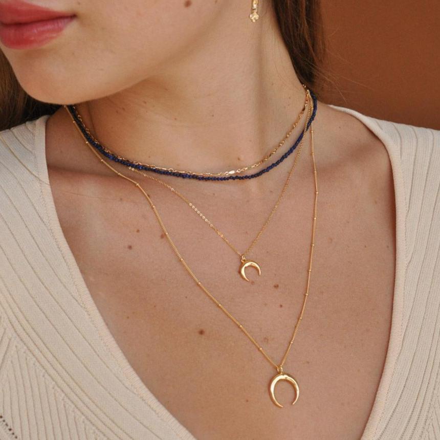 Double horn pendant meaning sale