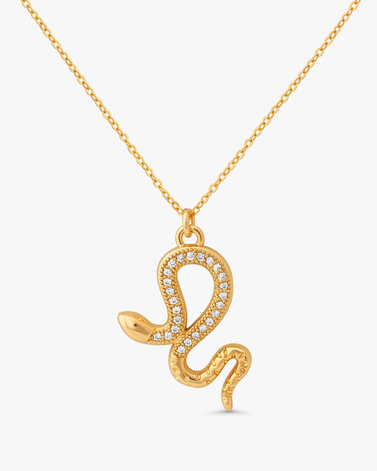 Jolie Snake Necklace in 14k gold filled metal with paved crystal serpent pendant on white background