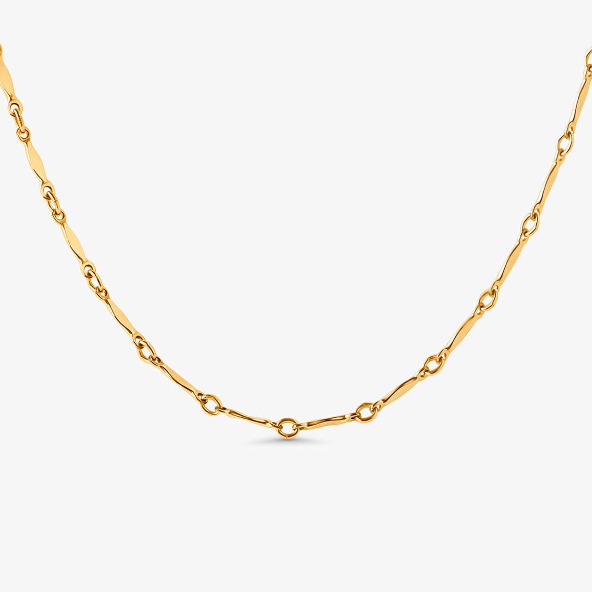 Dagny Flat Bar Layering Necklace in 14k gold filled station chain on white background.