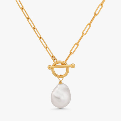 A gold chain necklace with a toggle clasp and a single baroque-style white pearl pendant, shown against a light gray background.