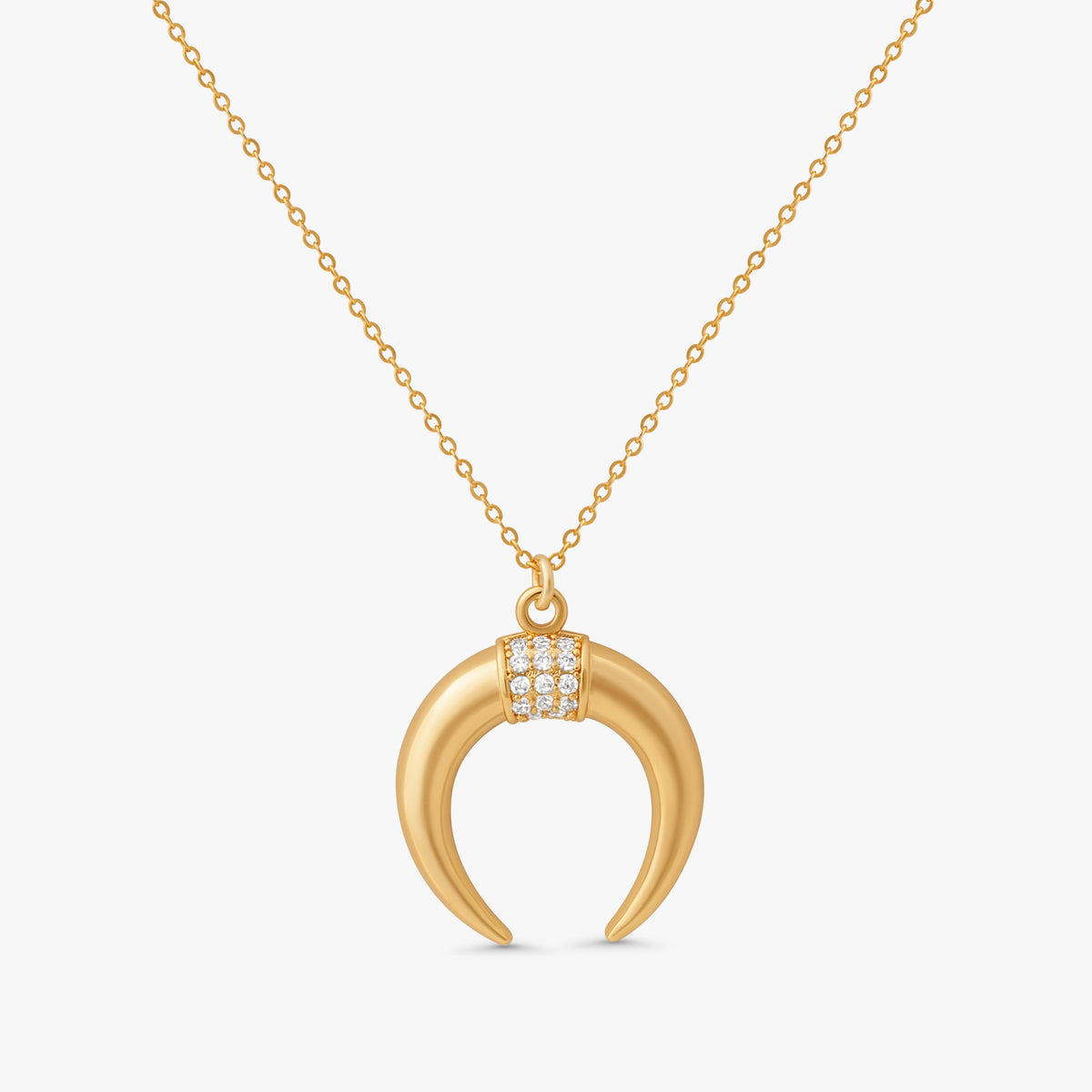 Fara Double Horn Tusk Necklace in 14k gold filled metal with crystal studded crescent pendant on white background