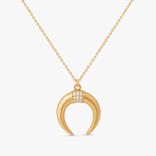 Fara Double Horn Tusk Necklace in 14k gold filled metal with crystal studded crescent pendant on white background