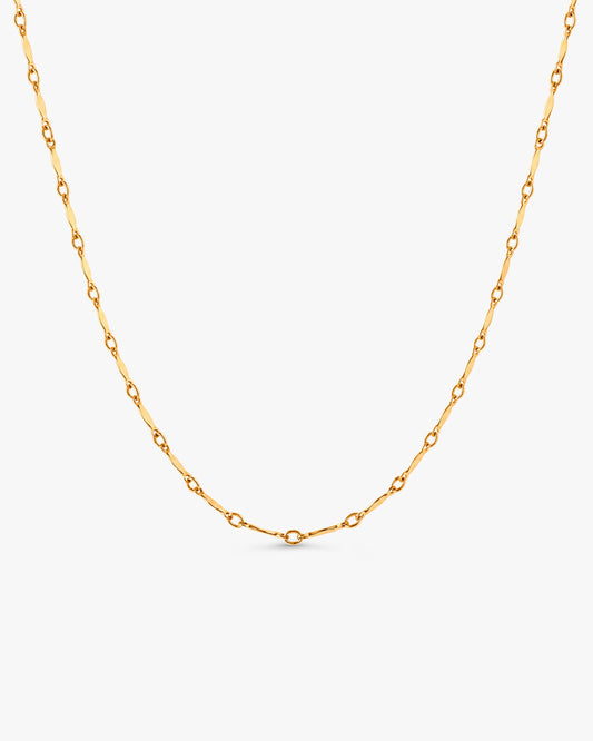 Dagny Flat Bar Layering Necklace in 14k gold filled station chain on white background.