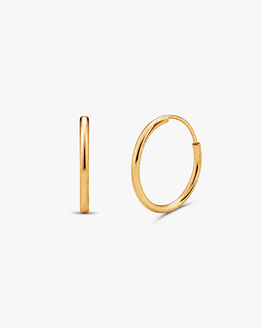 A pair of polished gold hoop earrings, one shown in a side profile view and the other in a front-facing view, on a clean white background.