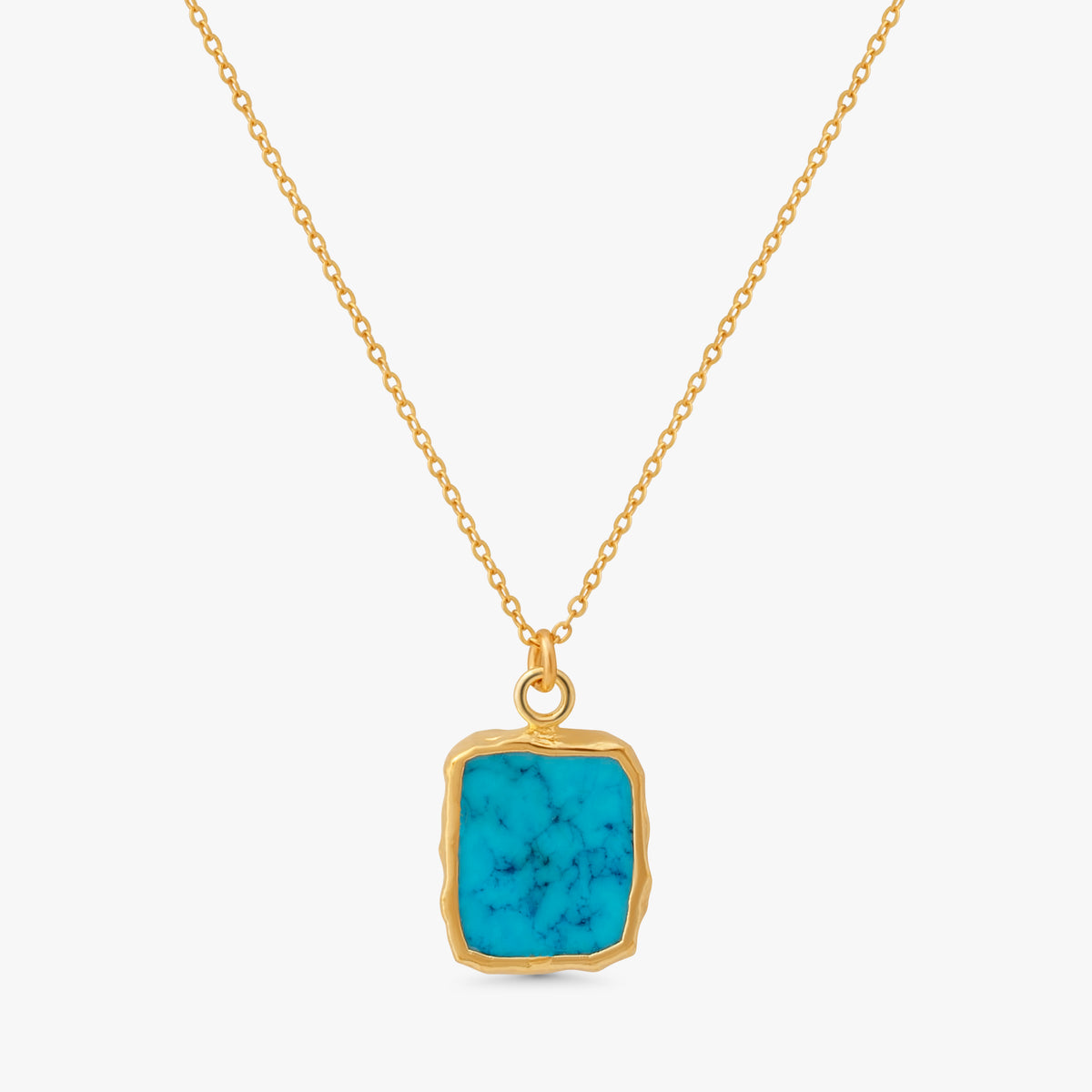 A gold chain necklace with a square pendant featuring a vibrant turquoise blue stone with natural white veining, set in a rustic gold bezel, on a light gray background.
