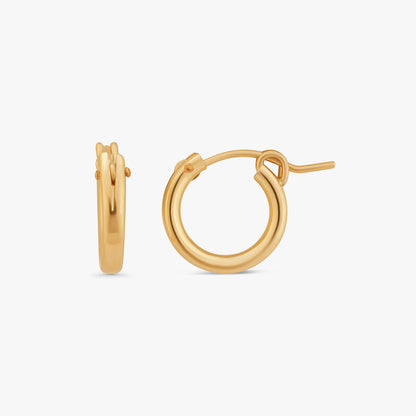 A pair of polished gold hoop earrings shown on a clean, light gray background, displaying both a side profile and a front-three-quarter profile.