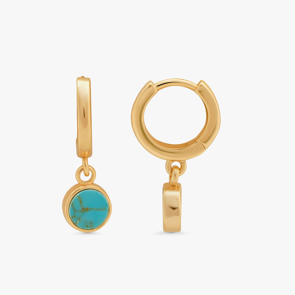A pair of gold huggie hoop earrings with a small round turquoise stone dangle, shown from two angles on a light gray background.
