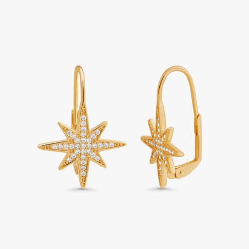 A pair of gold starburst hoop earrings with pavé-set clear stones, shown from front and side angles on a light gray background.