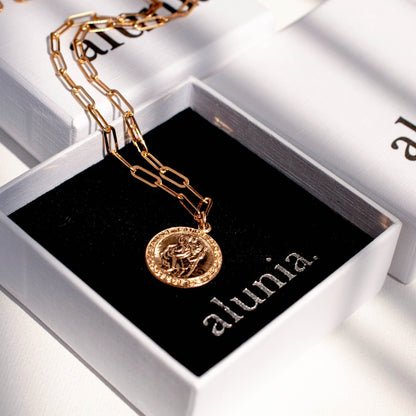 Auri Saint Christopher 14k gold filled paperclip necklace presented inside black Alunia jewelry box