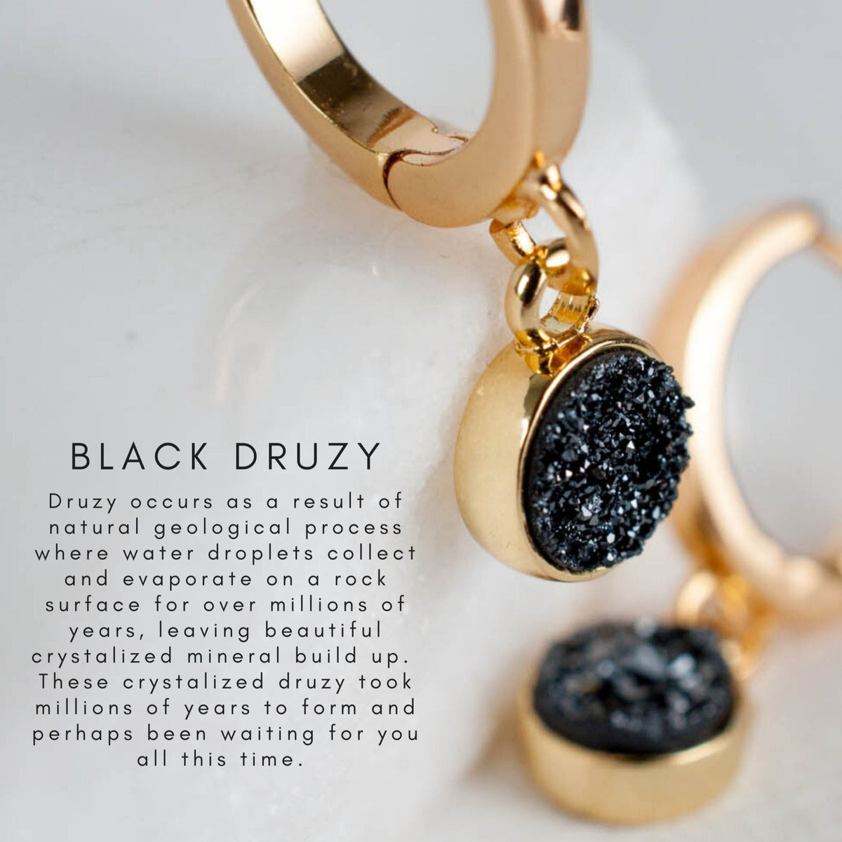 Close-up product view of women's 14k Gold Plated Ziva Druzy Hoop Earrings resting next to a card.
