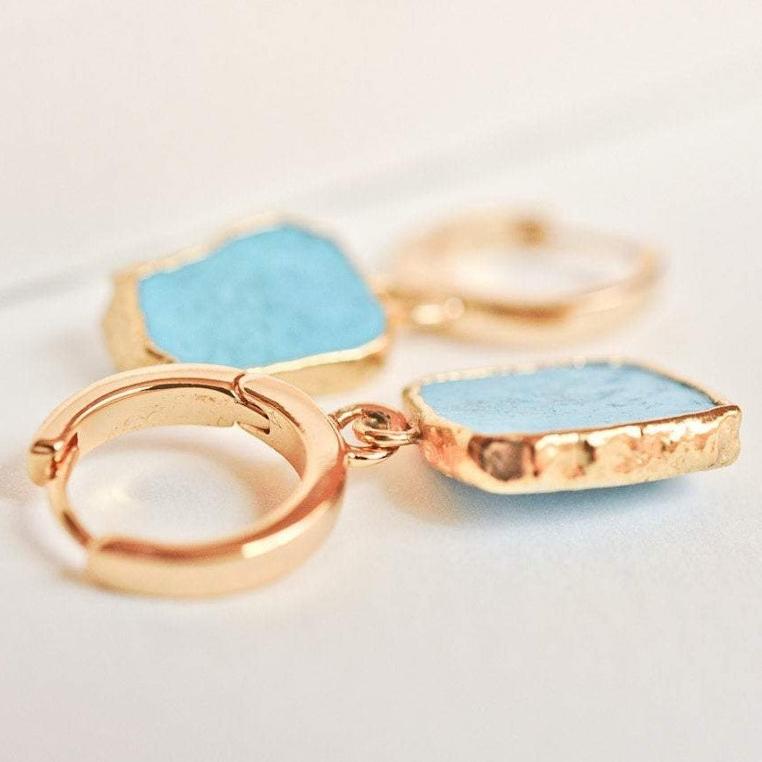 Gemma Turquoise 14k gold plated hoop earrings with square turquoise stones displayed flat