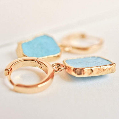 Gemma Turquoise 14k gold plated hoop earrings with square turquoise stones displayed flat