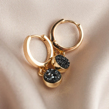 Pair of women's 14k Gold Plated Ziva Druzy Hoop Earrings displayed flat on soft beige silk cloth.