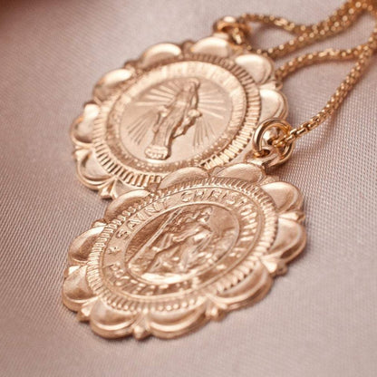 Two Viva Saint Christopher 14k gold filled scalloped coin medallions stacked together on neutral background