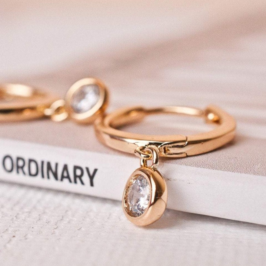 solitaire hoop earrings in gold 